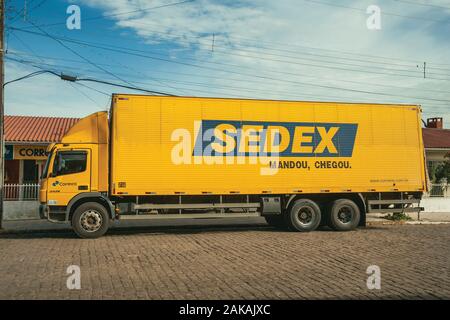 Sedex truck, an express delivery service from the Brazilian Postal Service, near a post office in Cambara do Sul. A tourist town in southern Brazil. Stock Photo