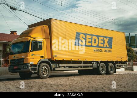 Sedex truck, an express delivery service from the Brazilian Post Service, in a street of Cambara do Sul. A tourist town in southern Brazil. Stock Photo