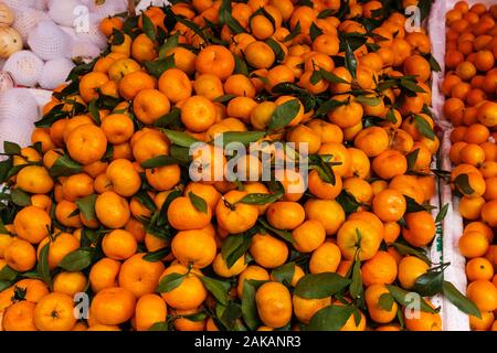 pile of tangarine fruits on fruit market Stock Photo