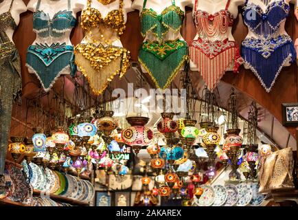 A shop in the Grand Bazaar. Lambs belonging to the patterns of colorful Turkish culture inside. Includes porcelain plates and belly dancer dress. Stock Photo