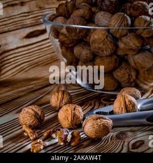 Healthy food: Round nuts with walnuts lie on a wooden table Stock Photo