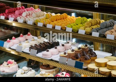 sweets and cakes on display in bakery shop Stock Photo