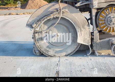 The joint cutter machine on a brushed concrete surface. Construction equipment for cutting saw slab. Stock Photo
