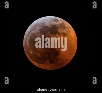 Full moon against black sky Stock Photo