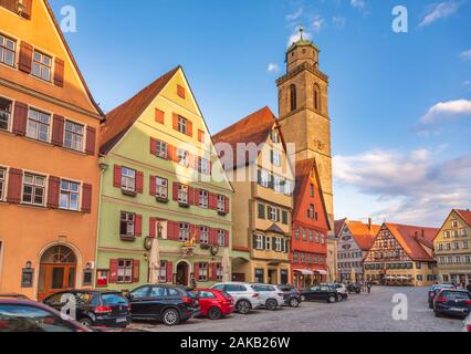 Dinkelsbuhl, Germany - May 11, 2019: Hotels and shops along the Weinmarkt (Wine Market) street with Marktplatz (Market Square) seen in background Stock Photo