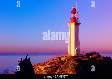 Lighthouse on seashore at sunset, Lighthouse Park, Vancouver, British Columbia, Canada