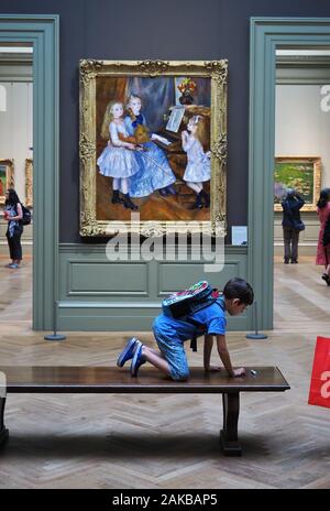New York City, NY USA. Jul 2017. Visitors inside the Metropolitan Museum of Art enjoying the artwork and other forms of relaxation. Stock Photo