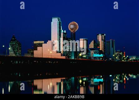 City skyline with skyscrapers under clear sky at night, Dallas, Texas, USA Stock Photo