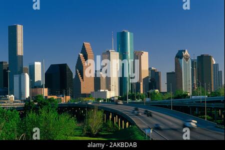 Skyline with skyscrapers and traffic on highway in city of Houston, Texas, USA Stock Photo