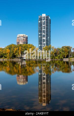 Canada, Province of Quebec, Montreal and Laval, modern buildings on the banks of the Rivière des Prairies, mirror effect Stock Photo