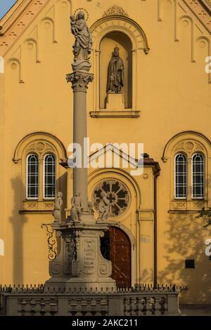 Slovakia, Bratislava, church of the Capuchins consecrated in 1717 and dedicated to Saint-Etienne of Hungary with on its forecourt a column erected in 1723 recalling the epidemic of plague Stock Photo