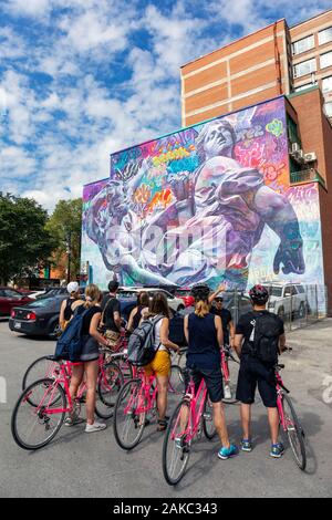 Canada, Province of Quebec, Montreal, Plateau-Mont-Royal, MURAL Urban Art Festival, Pichiavo Duo of Spanish Artists, Guided Tour of Tourists by Bike Stock Photo