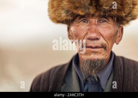 Kyrgyzstan, Osh Province, Sary-Moghul, portrait of an elderly man wearing a fur hat Stock Photo