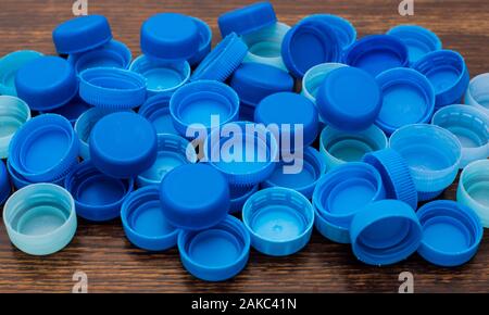 close-up of a large number of blue, plastic bottle caps Stock Photo