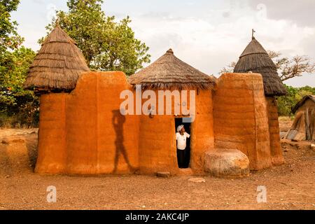 Benin, Nothern distict, Atacora mountains area, Koussoukoingou, woman in her tata made with banco (soil mixed with straw), traditional defensive two-storey habitat typical of northern Benin Stock Photo