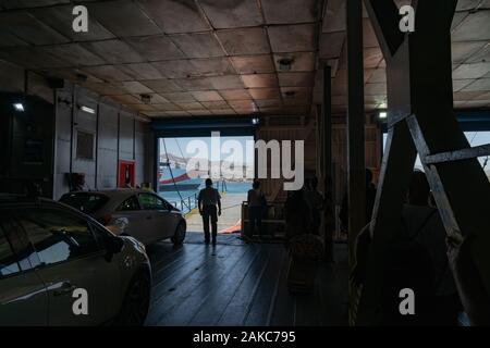 Naxos Greece - August 11 2019;  looking out from lower deck of  Greek Island ferryboat arriving at destination. Stock Photo