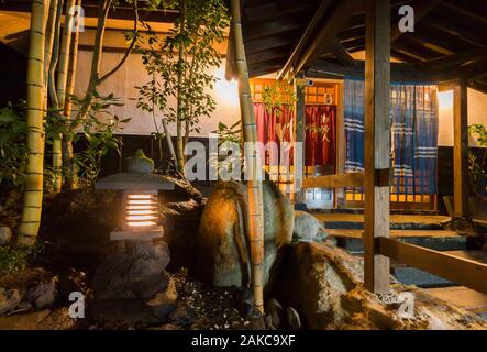 Japan, Kyushu Island, Kumamoto Region, Kurokawa Onsen, night view of a ryokan entrance porch, traditional luxury inn Stock Photo