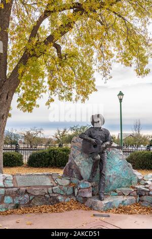 Wilcox, AZ - Nov. 24, 2019: This bronze statue in Railroad Park by Buck McCain is of Rex Allen, an American western film and television actor, singer Stock Photo