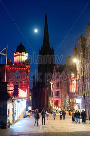 Edinburgh, Scotland, UK. 8th Jan 2020. Clear sky and a 95% waxing gibbous moon over the Royal Mile at Dusk. Full moon due on the 10th January. Credit: Craig Brown/Alamy Live News Stock Photo