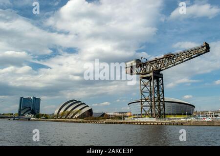 Looking west along the River Clyde at the Finnieston Crane, SSE Hydro, SEC Armadillo and Crown Plaza hotel, Glasgow, Scotland