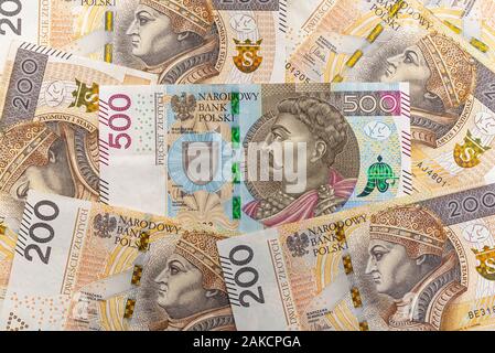 The front side of a rare Polish 500 PLN banknote lying between 200 PLN,  Polish zloty banknotes. Stock Photo