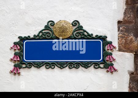 Blank empty blue street sign on a plastered wall with copy space Stock Photo