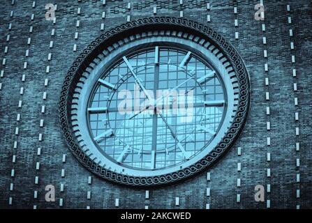 Big clock on a dark wall. Church of the most sacred heart of our Lord. Prague, Czech Republic Stock Photo