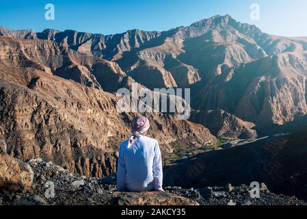 Arab man enjoying Jais desert mountain view in Ras al Khaimah UAE Stock Photo