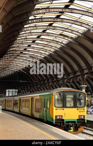 Class 150 'Sprinter' diesel multiple unit train in the debranded livery of London Midland Trains at York station, UK. Stock Photo