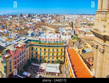 MALAGA, SPAIN - SEPTEMBER 26, 2019: The view on Plaza del Obispo square with outdoor cafes, restaurants and Palacio Episcopal (Bishop's Palace) from r Stock Photo