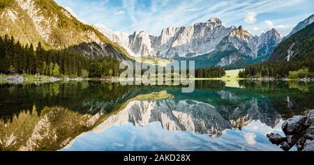 Beautiful morning view of famous Superior Fusine Lake with Mount Mangart in the background at sunrise, Tarvisio, Udine province, Friuli Venezia Giulia Stock Photo