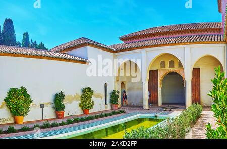 MALAGA, SPAIN - SEPTEMBER 26, 2019: Patio del Aljibe (Reservoir court) is the courtyard with pool, located in Nasrid Palace (Palacio Nazari) of Alcaza Stock Photo