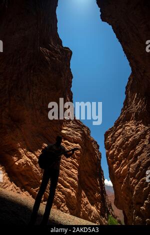 A man playing guitar at the Anphitheatre at Devil's Gorge, on the Salta-Cafayate road, Argentina Stock Photo