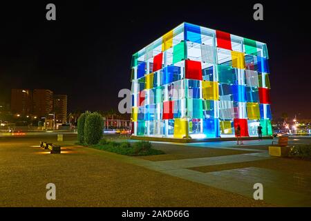 MALAGA, SPAIN - SEPTEMBER 26, 2019: The colorful glass cube of Centre Pompidou Malaga modern art gallery in bright evening lights, on September 26 in Stock Photo