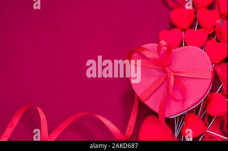 Heart shape gift box on pink fabric. Special day gift background Stock Photo