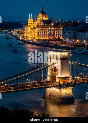 Budapest, Hungary, view of the Hungarian Parliament building and Szechenyi Chain Bridge over the Danube river at dusk. Stock Photo