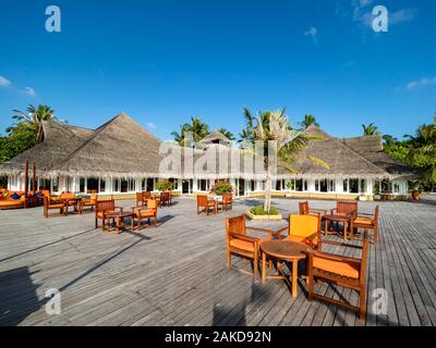Tourist Resort, Bungalows between palm trees, Maldives Island, South Male Atoll, Maldives Stock Photo