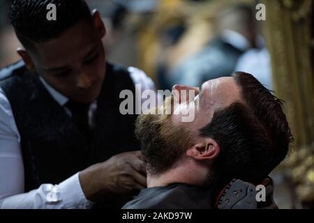 Hairdresser cutting beard, traditional barber shop, Mr Cobbs, Cape Town, South Africa Stock Photo