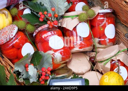 Fermented food concept. Jars with homemade pickled or fermented  colorful vegetables in farmer agricultural market. Farm product in local market. Rura Stock Photo