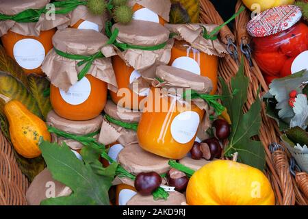 Jars with homemade pickled or fermented  colorful vegetables in farmer agricultural market. Farm product in local market. Healthy food concept. Rustic Stock Photo