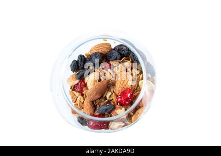 Mix of dried fruits and nuts. Mix of nuts in a glass. Stock Photo