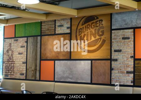 Vero Beach, FL/USA-1/6/90: A Burger King exterior sign with the competitor McDonalds across the street in the background on a bright sunny day. Stock Photo