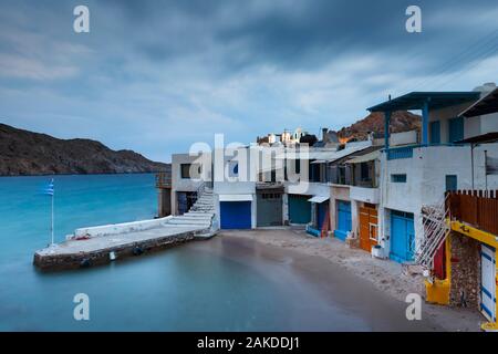 View of boat houses in Firopotamos fishing village on Milos island in Greece. Stock Photo
