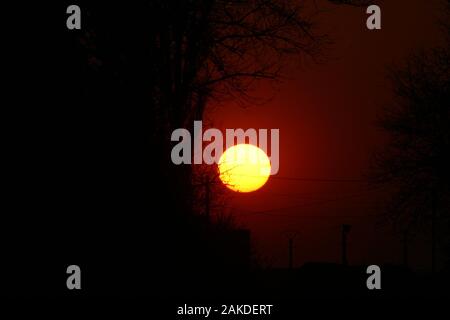 Large bright sunset sun Stock Photo