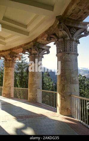 Bearing classical columns framing an oval balcony on the corner of the building of the sanatorium "Mountain Armenia" in the resort of Dilijan Stock Photo