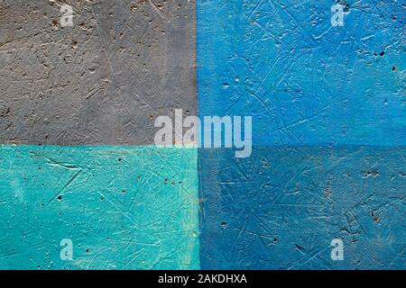 a wall texture that is painted in different colors, shades of blue, segments of different colors Stock Photo