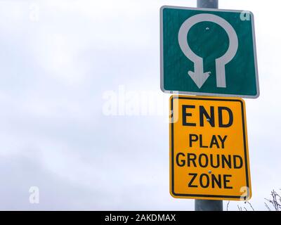 End Play Ground Zone sign with an arrow Stock Photo