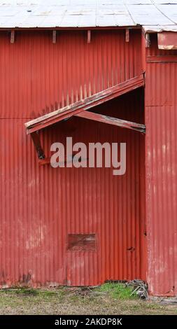 red barn awning shed old abandoned farm building Stock Photo