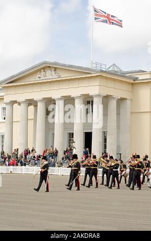 Sandhurst, Berkshire, UK - June 16, 2019: Spectators on the steps of Old College watching a performance by the Royal Artillery Band at the historic Sa Stock Photo