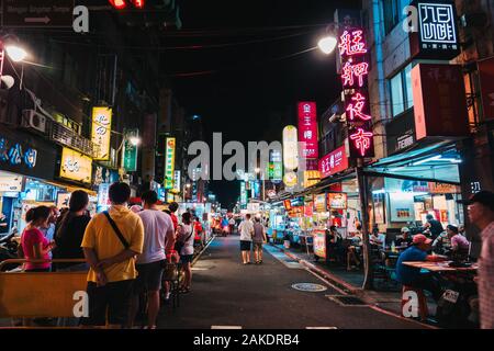 The Guangzhou Street Night Market alive at night in Taipei, Taiwan Stock Photo